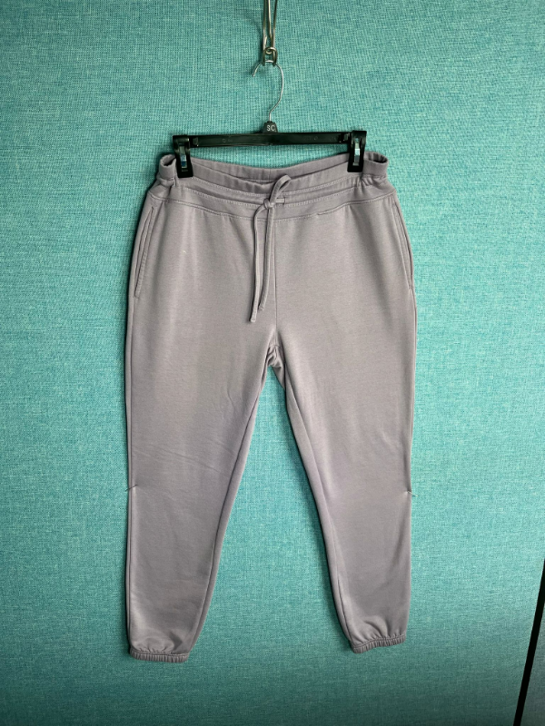 Unisex jogger sweatpants in light purple with drawstring waist and elastic cuffs
