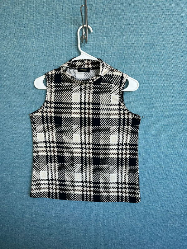 Sleeveless black and white plaid mock neck top with beige accents by Expressions